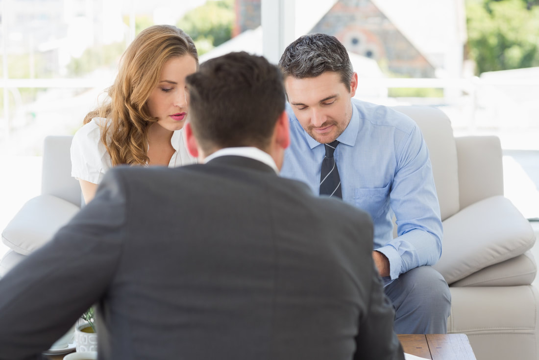 couples talking to a man