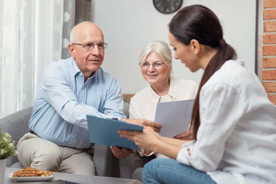 old couple talking to an agent